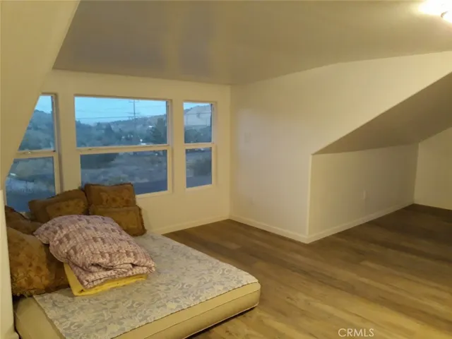 a bedroom with a bed and dresser