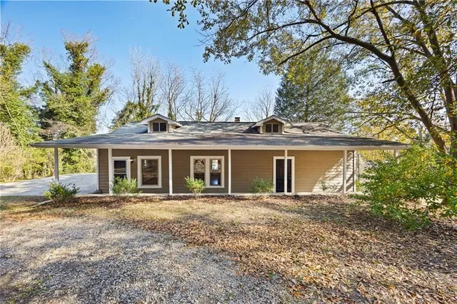 front view of a house with a garden