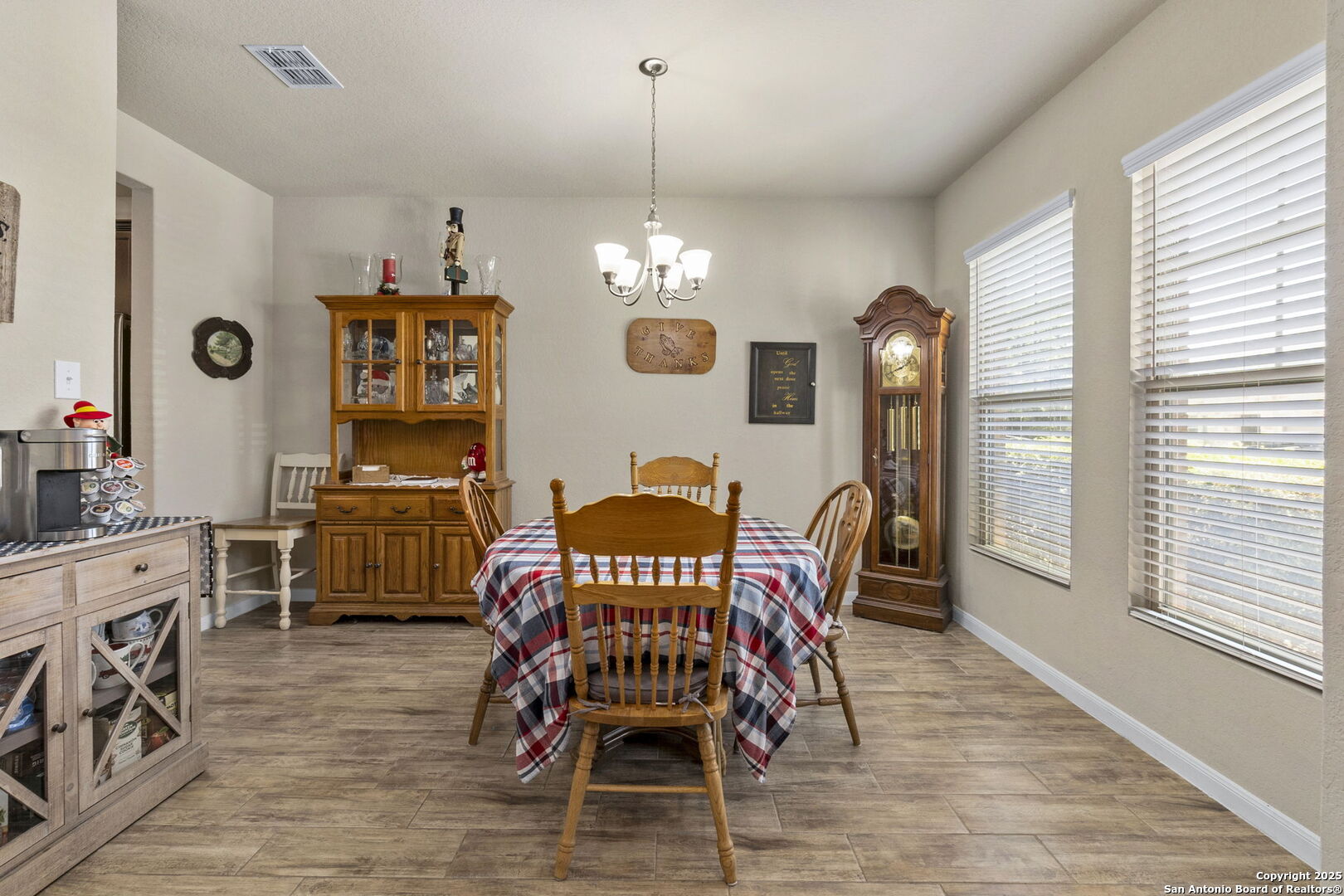 10343 Rosalina Loop Converse, TX 78109 - Photo 12 of 38 a view of a dining room with furniture and wooden floor