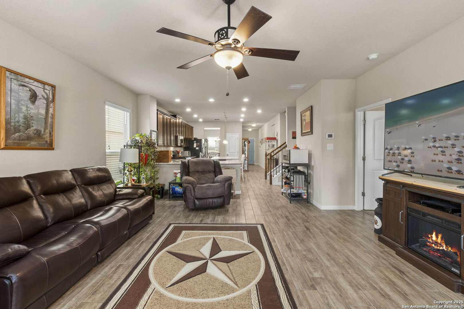 10343 Rosalina Loop Converse, TX 78109 - Photo 16 of 38 a living room with furniture and a fireplace