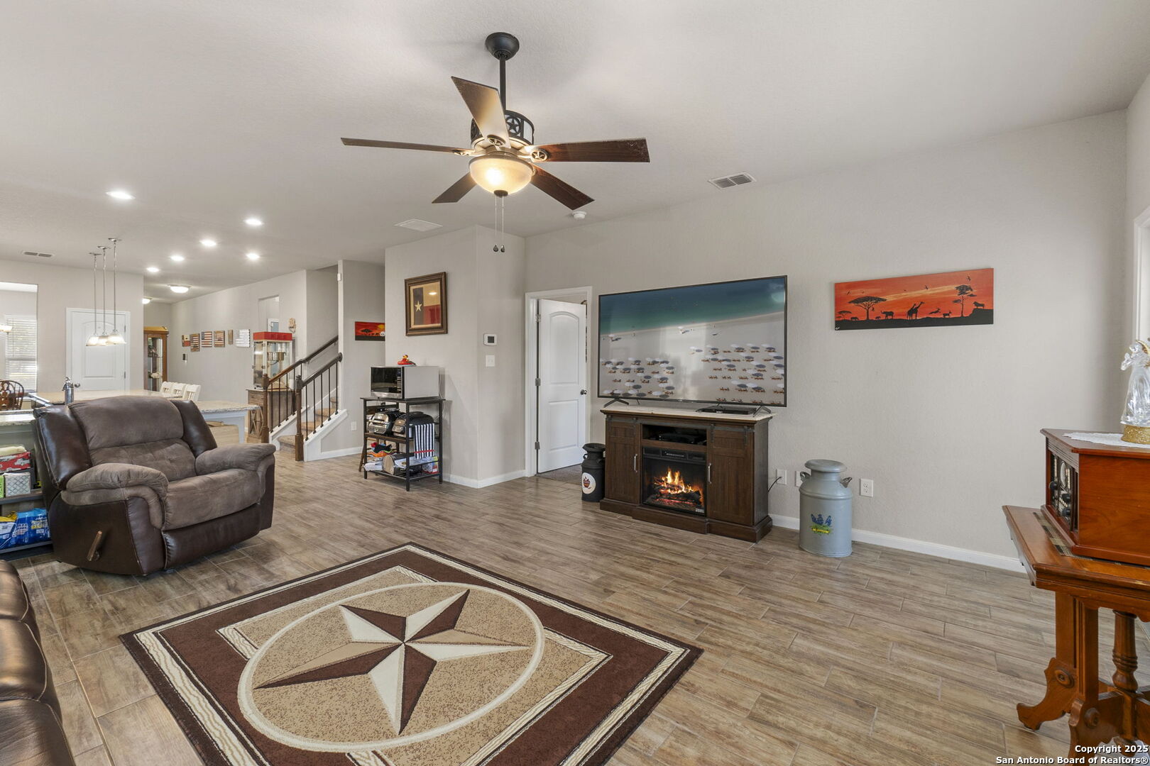 10343 Rosalina Loop Converse, TX 78109 - Photo 17 of 38 a living room with furniture and a fireplace