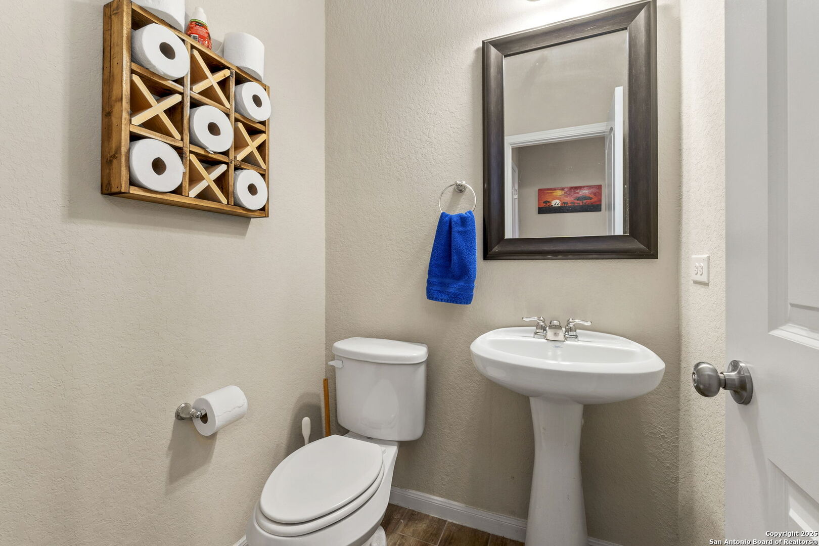 10343 Rosalina Loop Converse, TX 78109 - Photo 18 of 38 a bathroom with a toilet sink and mirror