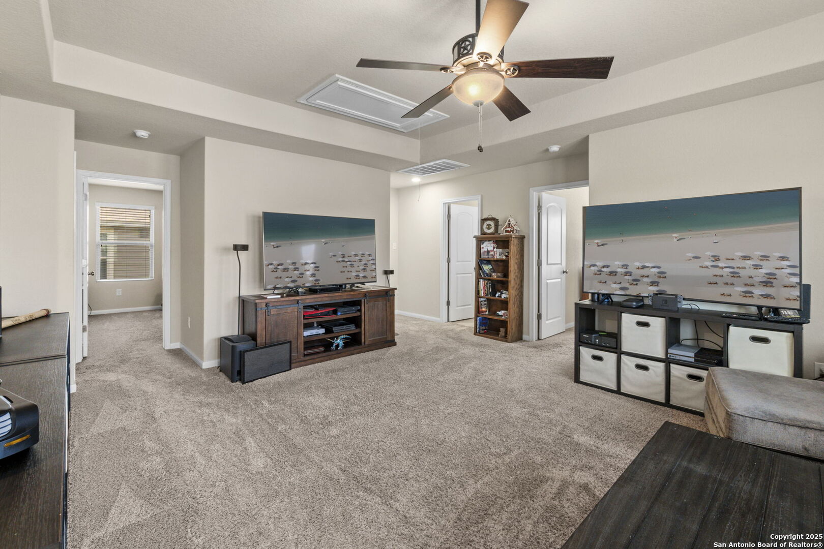 10343 Rosalina Loop Converse, TX 78109 - Photo 22 of 38 a living room with furniture and a flat screen tv