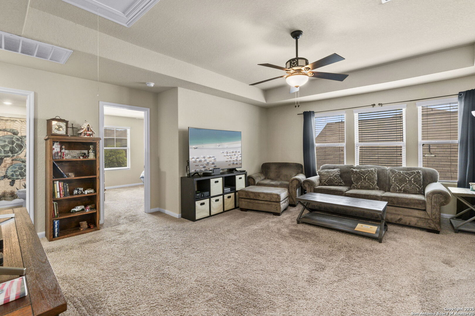 10343 Rosalina Loop Converse, TX 78109 - Photo 23 of 38 a living room with furniture and a flat screen tv