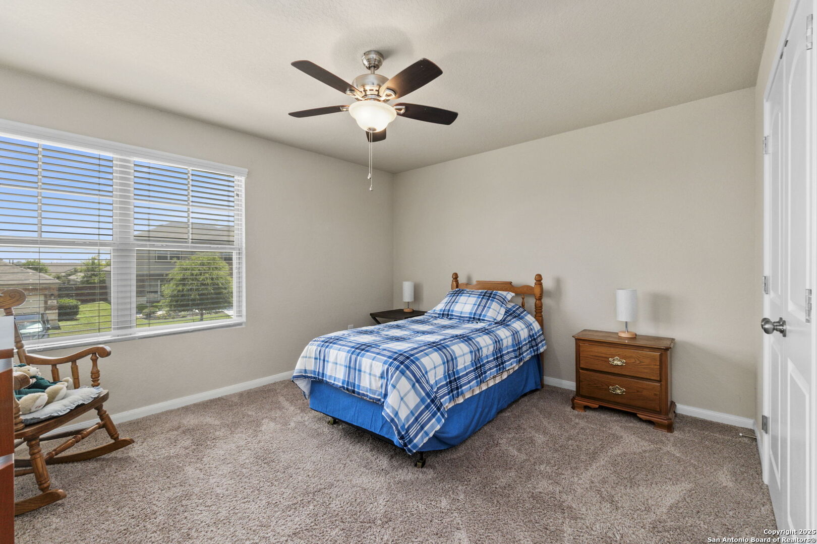 10343 Rosalina Loop Converse, TX 78109 - Photo 25 of 38 a bedroom with a bed and a window