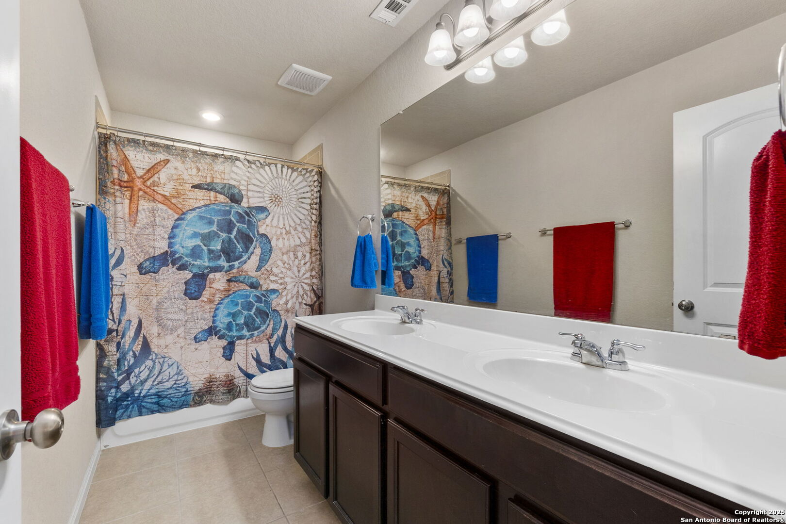 10343 Rosalina Loop Converse, TX 78109 - Photo 26 of 38 a bathroom with a sink a mirror and a shower