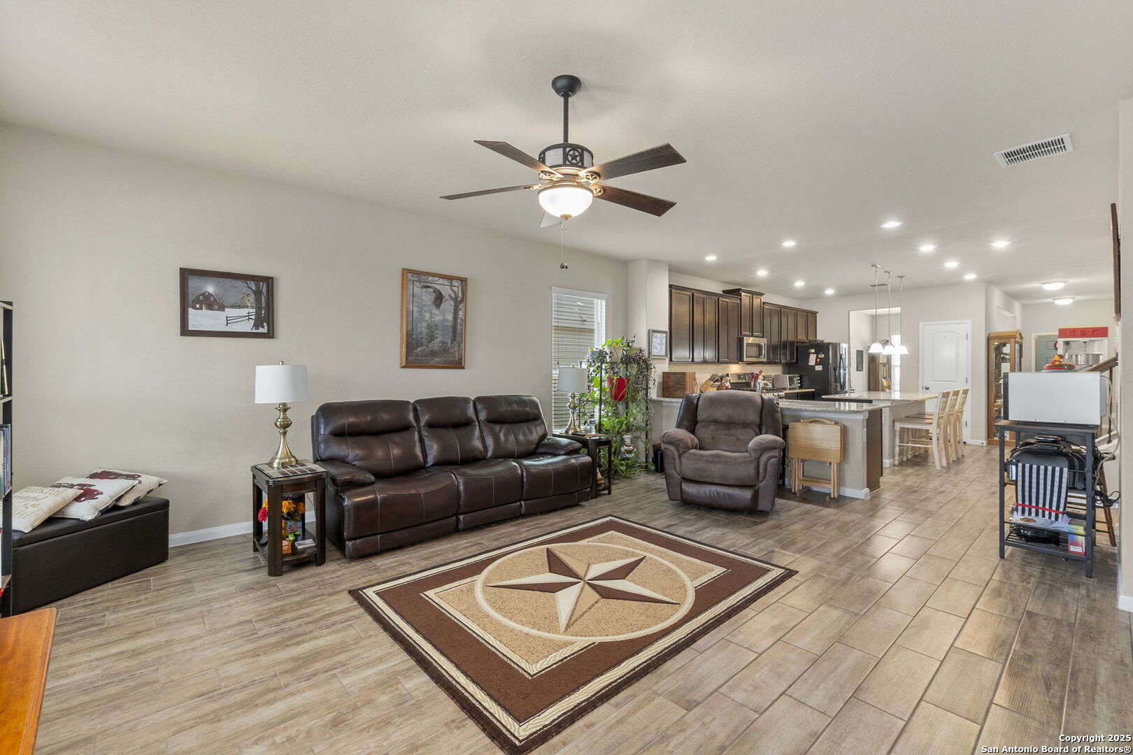 10343 Rosalina Loop Converse, TX 78109 - Photo 4 of 38 a living room with furniture and a view of kitchen