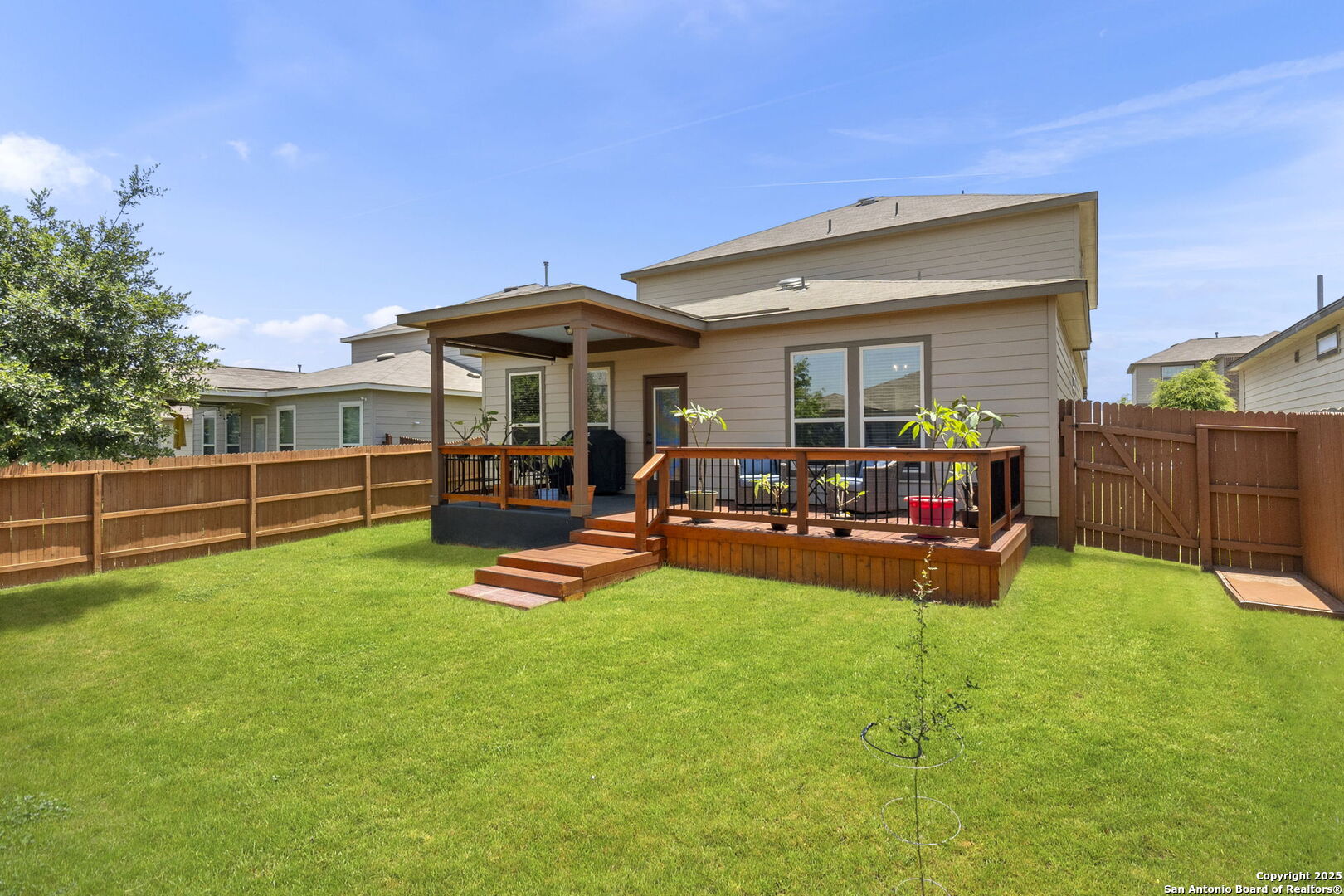 10343 Rosalina Loop Converse, TX 78109 - Photo 5 of 38 a view of a house with backyard porch and wooden fence