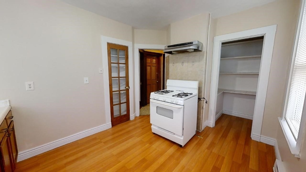 33 Bellingham Street, Unit 2 Chelsea, MA 02150 - Photo 3 of 18 a view of kitchen and utility room