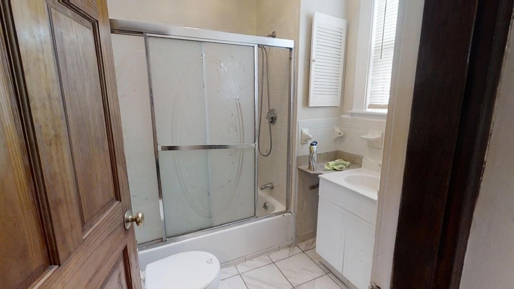 33 Bellingham Street, Unit 2 Chelsea, MA 02150 - Photo 6 of 18 a bathroom with a shower and a toilet