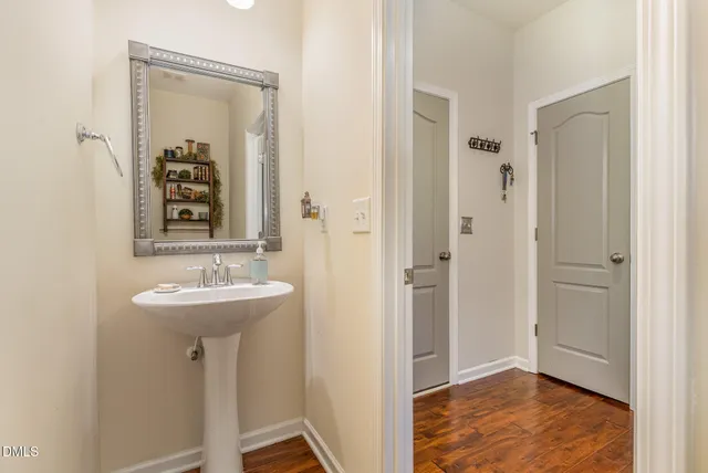 a bathroom with a sink and mirror