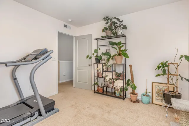 a bathroom with a granite countertop sink a toilet and a mirror