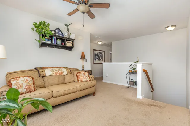 a balcony with couch and wooden floor