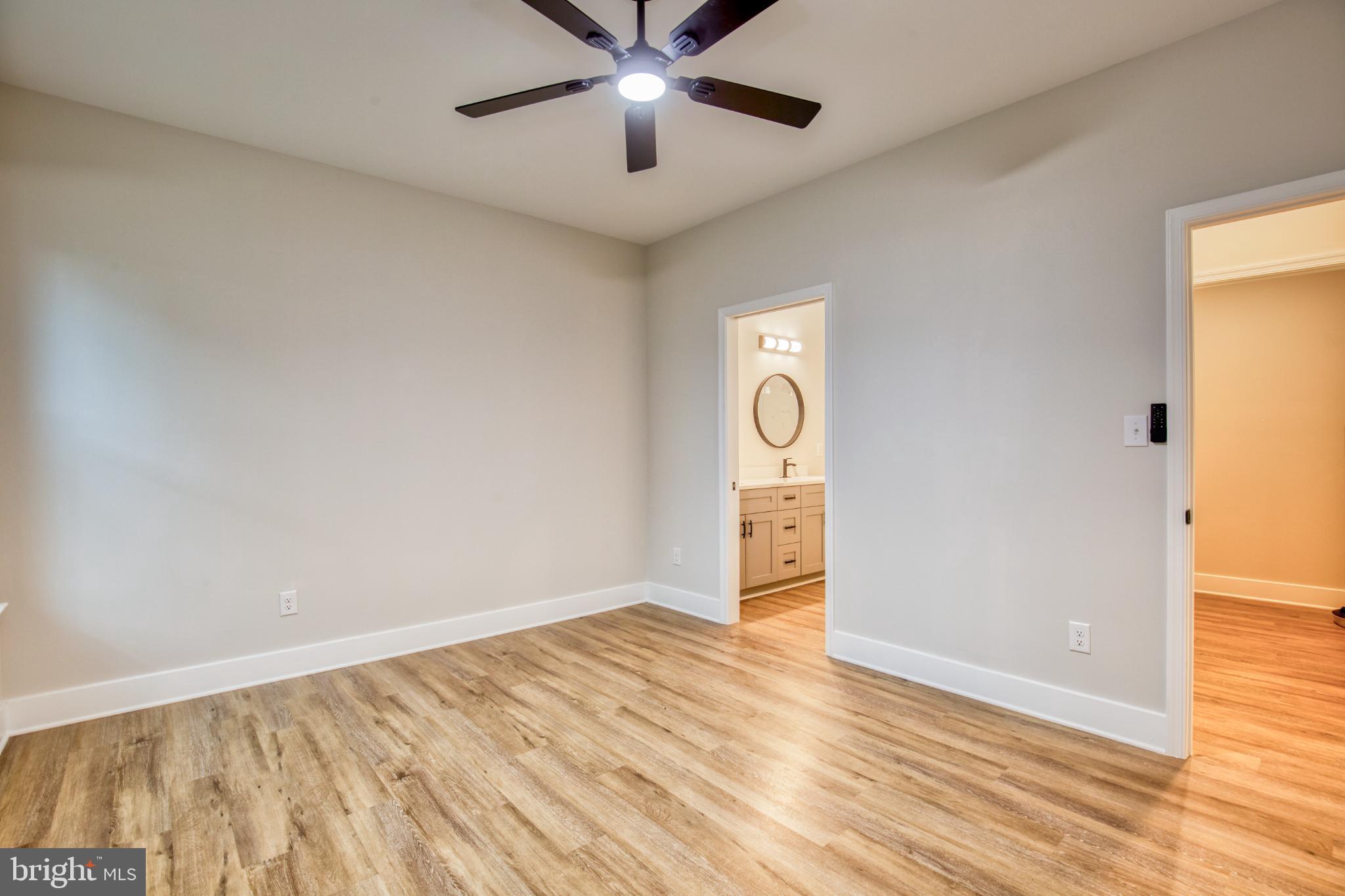 0 Beacon Court Montross, VA 22520 - Photo 11 of 19 a view of empty room with wooden floor and fan
