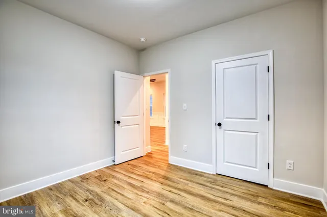 a view of a livingroom with wooden floor and closet