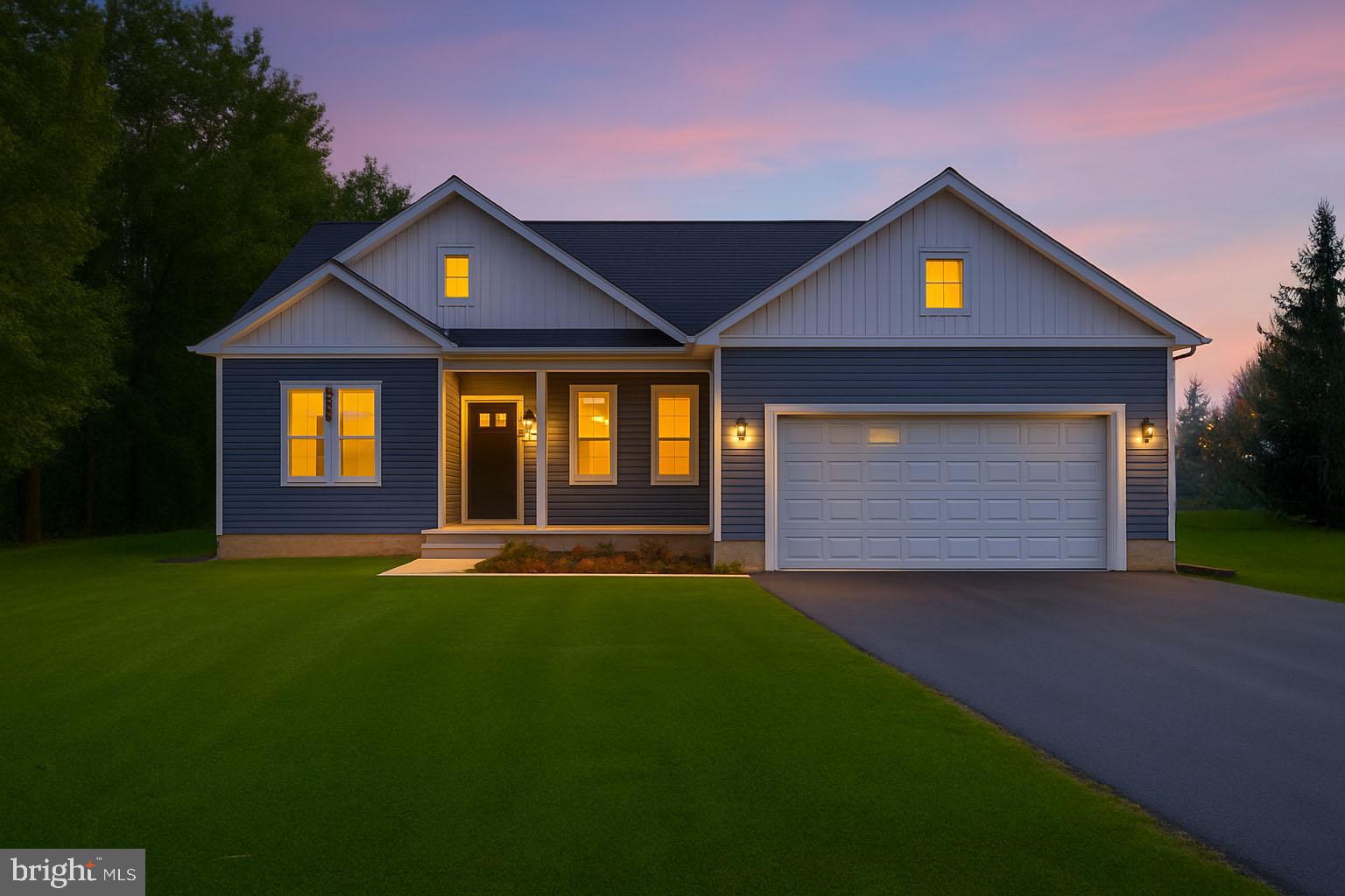0 Beacon Court Montross, VA 22520 - Photo 19 of 19 a front view of a house with a yard and garage