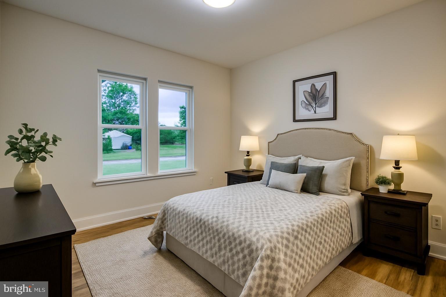 0 Beacon Court Montross, VA 22520 - Photo 7 of 19 a bedroom with a large bed and a potted plant