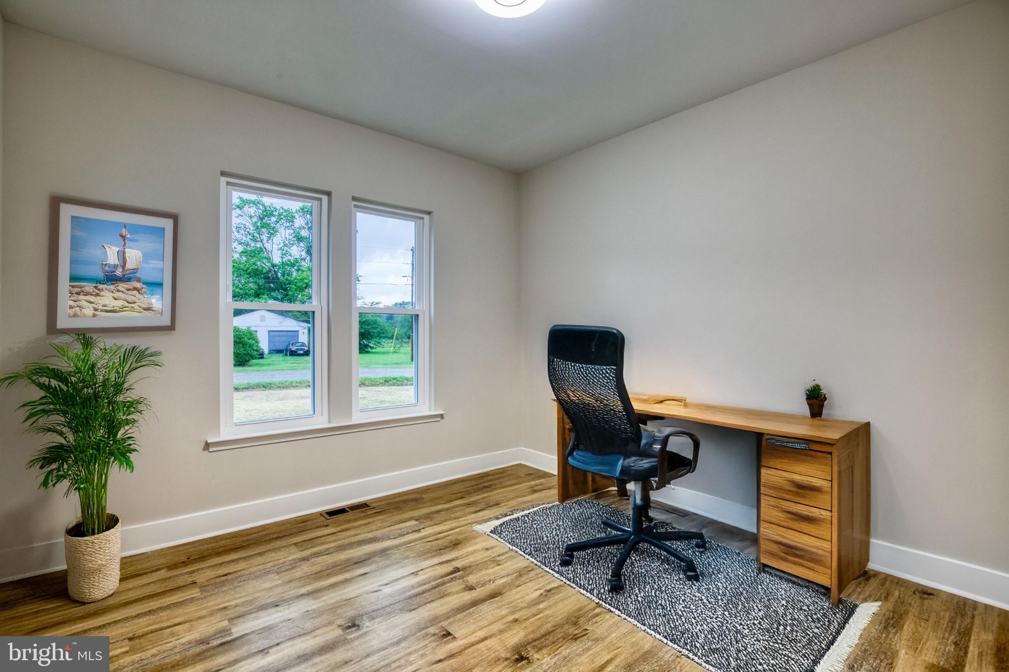 0 Beacon Court Montross, VA 22520 - Photo 9 of 19 a view of a workspace with furniture and a window