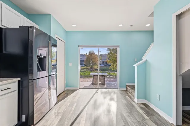 a kitchen with stainless steel appliances a refrigerator and a stove