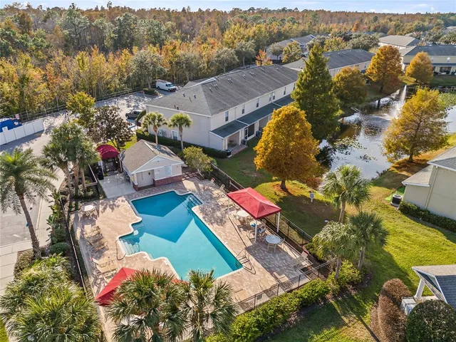 an aerial view of houses with yard