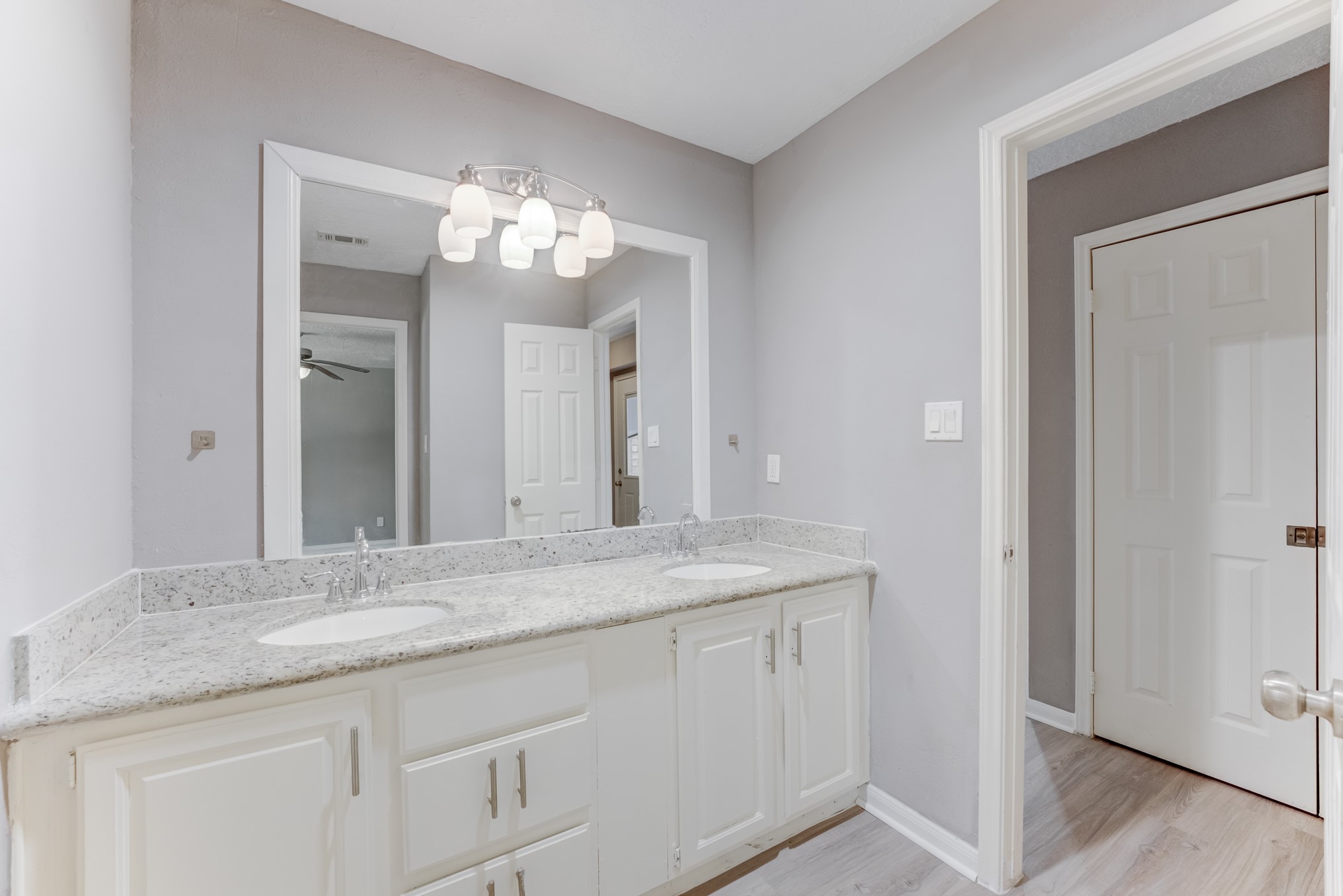 81 Oak Grove Lane Conroe, TX 77304 - Photo 18 of 50 a bathroom with a granite countertop sink and a mirror
