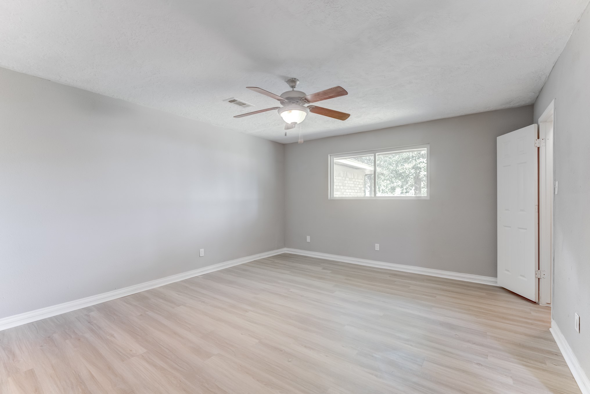 81 Oak Grove Lane Conroe, TX 77304 - Photo 23 of 50 a view of an empty room with a window