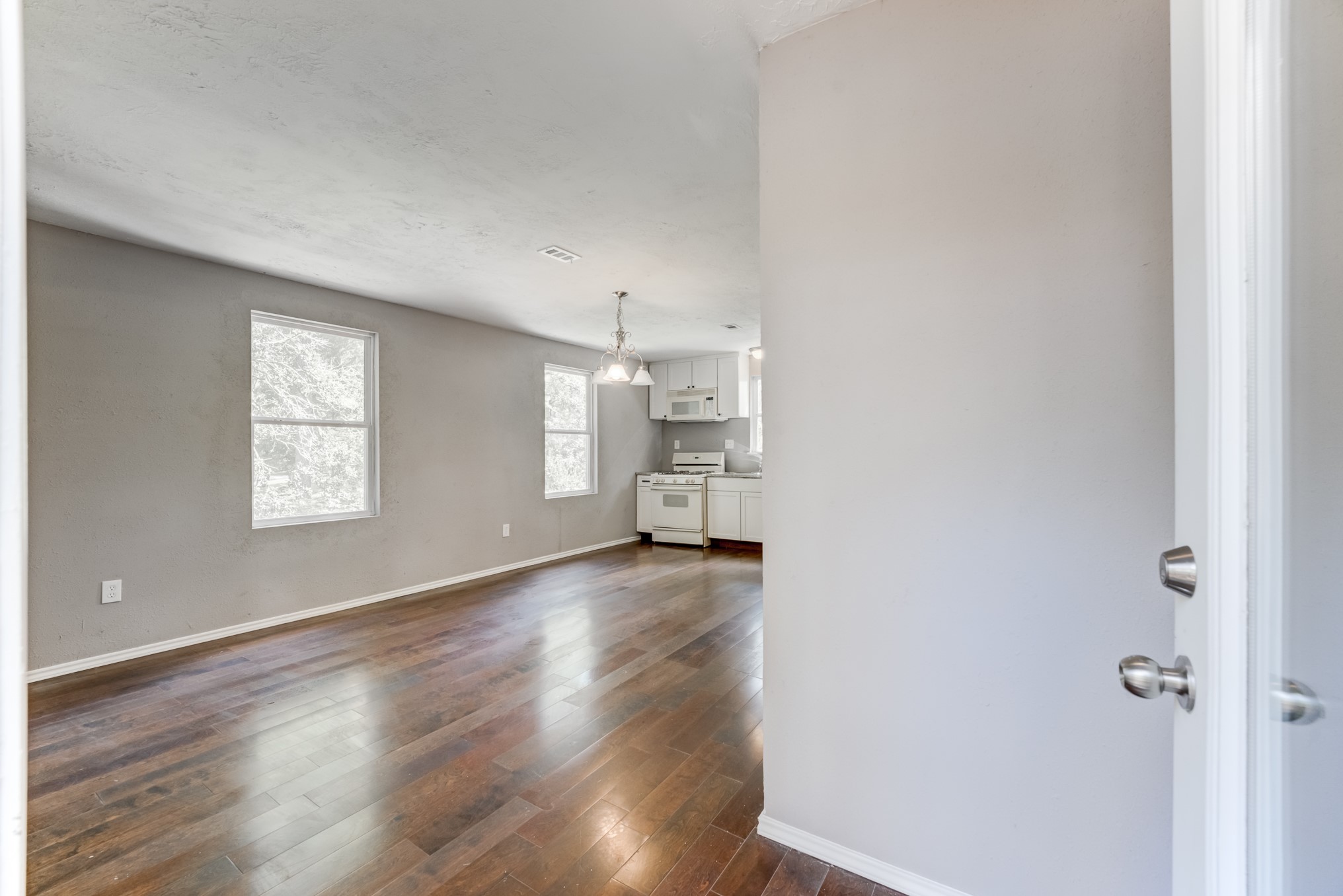 81 Oak Grove Lane Conroe, TX 77304 - Photo 36 of 50 a view of a big room with wooden floor and windows