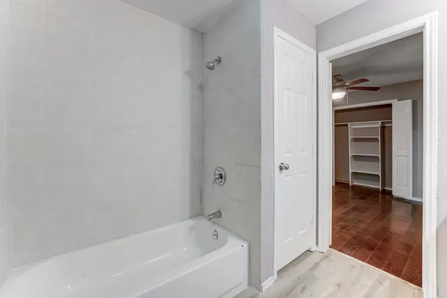 a white bath tub sitting in a bathroom