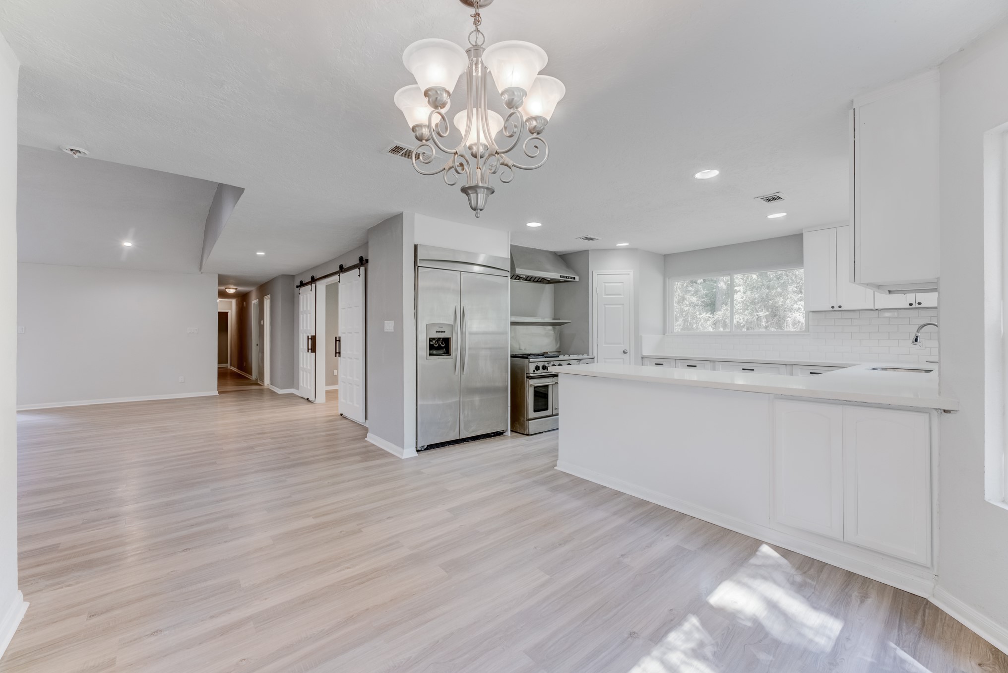 81 Oak Grove Lane Conroe, TX 77304 - Photo 4 of 50 a view of a kitchen with refrigerator and a sink