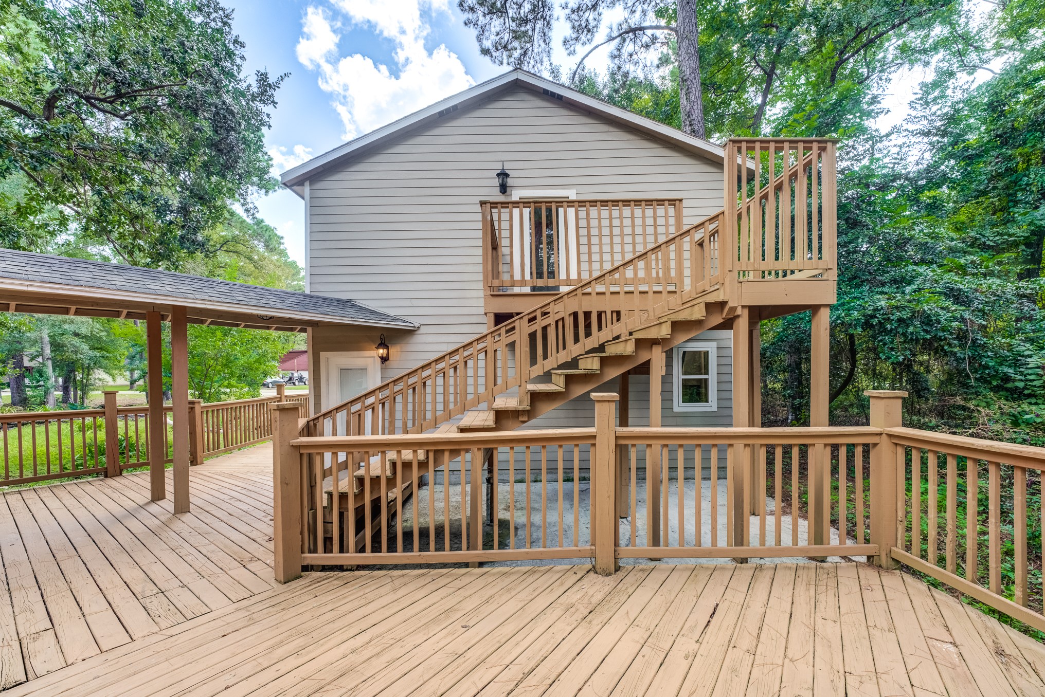 81 Oak Grove Lane Conroe, TX 77304 - Photo 47 of 50 a view of a wooden deck and a yard