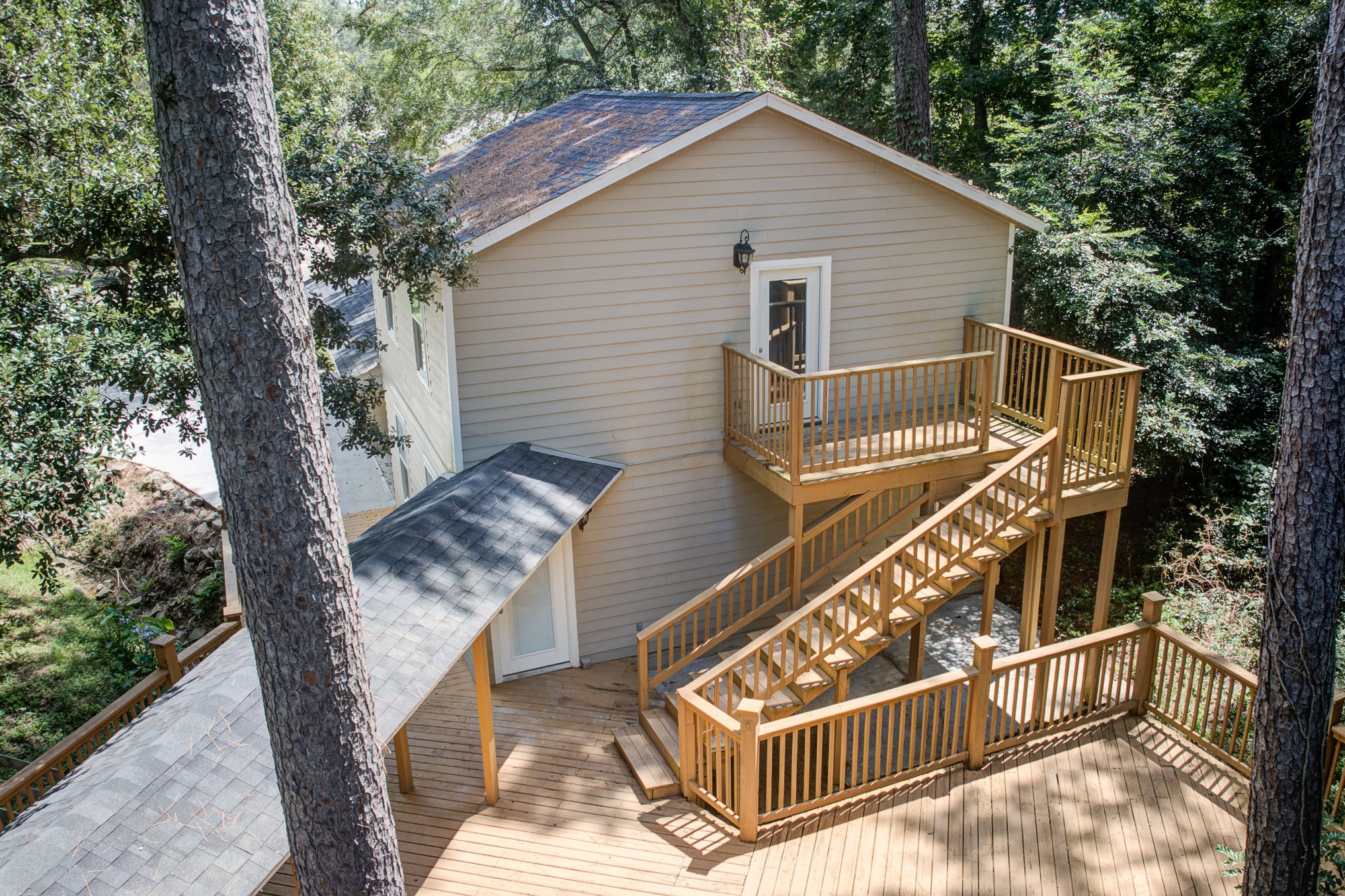 81 Oak Grove Lane Conroe, TX 77304 - Photo 48 of 50 a view of a house with backyard and trees