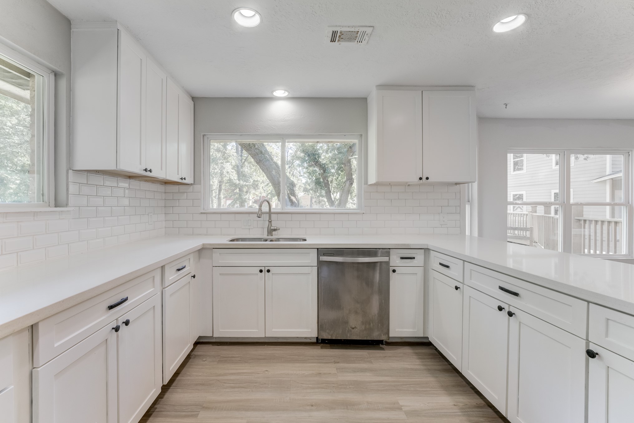 81 Oak Grove Lane Conroe, TX 77304 - Photo 8 of 50 a kitchen with white cabinets window and sink