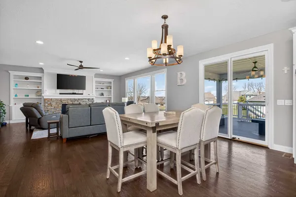 a kitchen with granite countertop white cabinets and stainless steel appliances