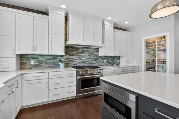 a bedroom with a large bed and a ceiling fan