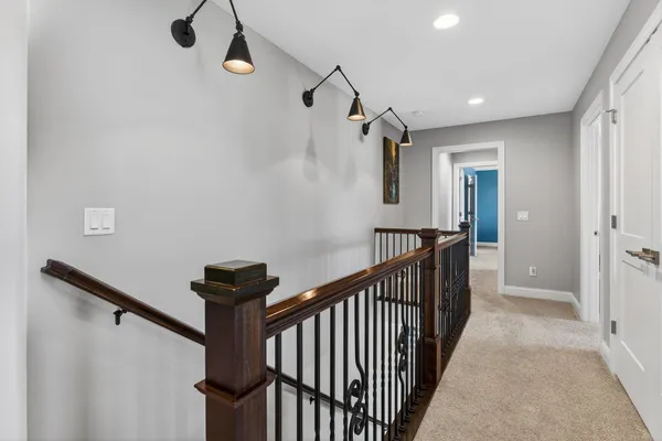 a en suite bathroom with a double vanity sink and a mirror