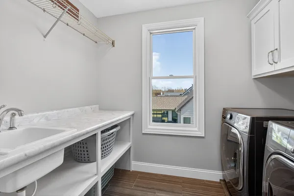 a bedroom with a bed and large window