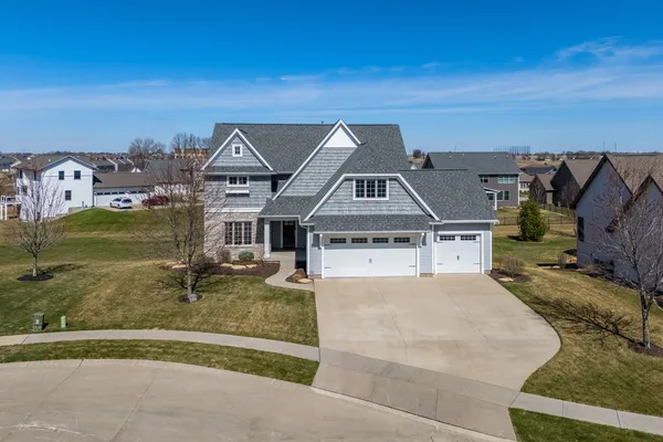 an aerial view of a house with a garden
