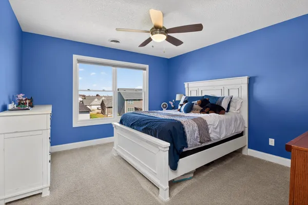 a spacious bathroom with a double vanity sink a mirror and a bathtub