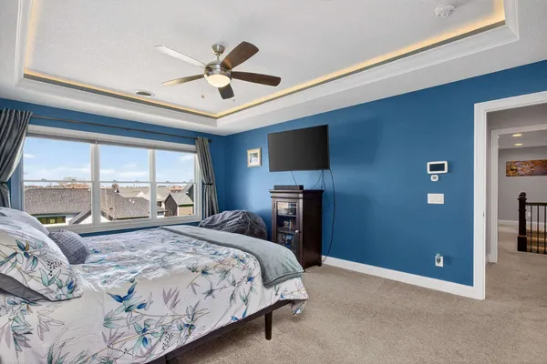 a kitchen with a sink cabinets and wooden floor