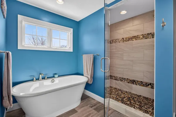 a bathroom with a granite countertop sink toilet and a mirror