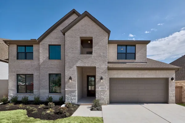 a front view of a house with yard