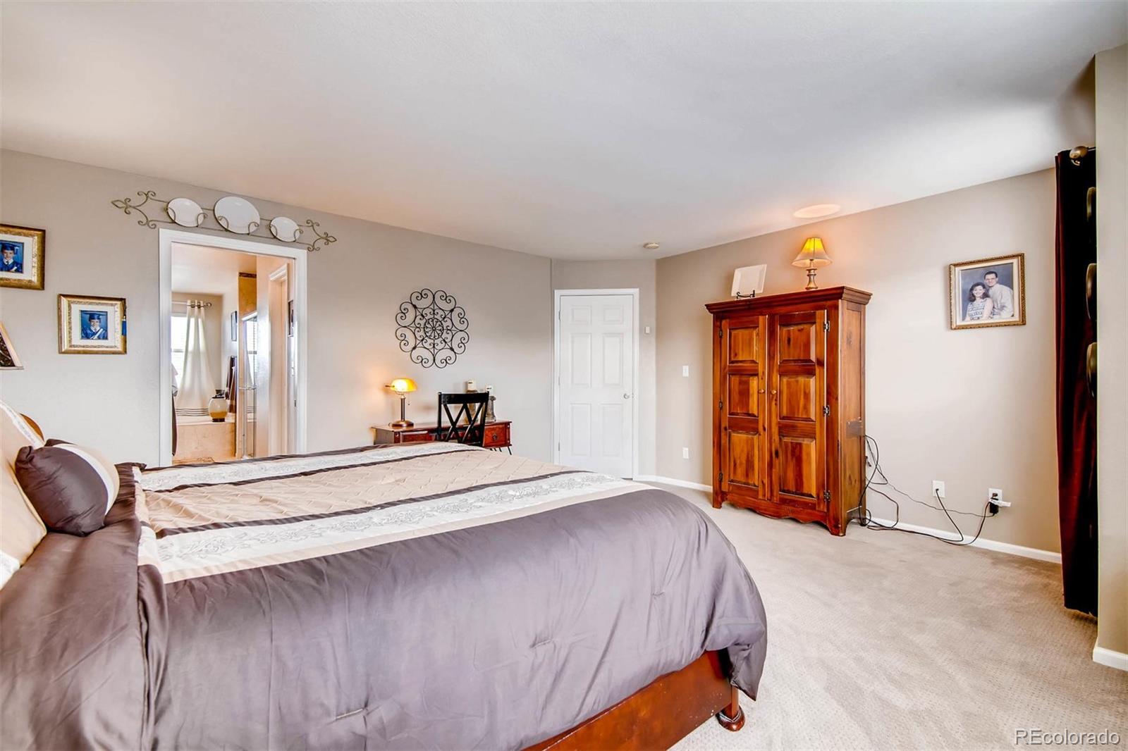 1665 Spring Water Lane Highlands Ranch, CO 80129 - Photo 21 of 34 a bedroom with a bed and a window