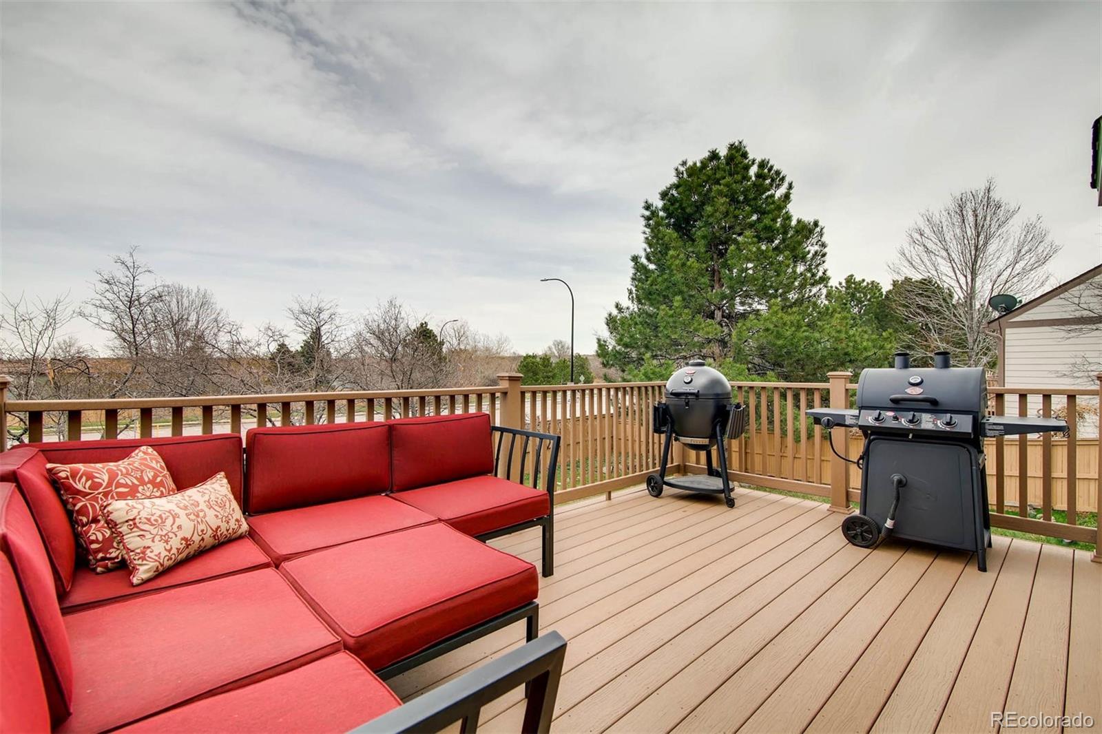 1665 Spring Water Lane Highlands Ranch, CO 80129 - Photo 32 of 34 a roof deck with a table and chairs