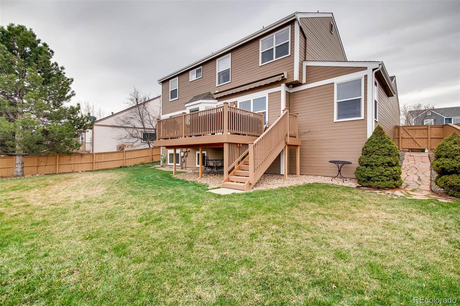 1665 Spring Water Lane Highlands Ranch, CO 80129 - Photo 33 of 34 a view of a house with a yard