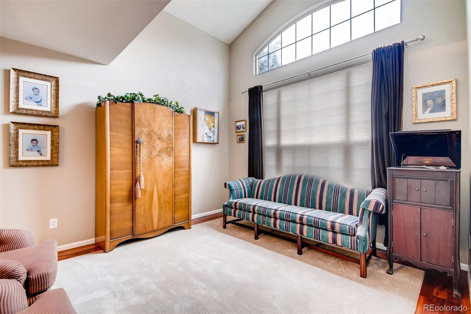 1665 Spring Water Lane Highlands Ranch, CO 80129 - Photo 4 of 34 a living room with furniture and a window