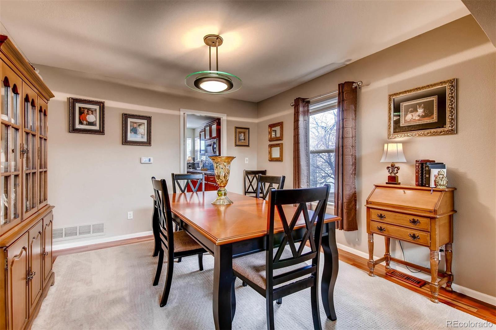 1665 Spring Water Lane Highlands Ranch, CO 80129 - Photo 7 of 34 a view of a dining room with furniture
