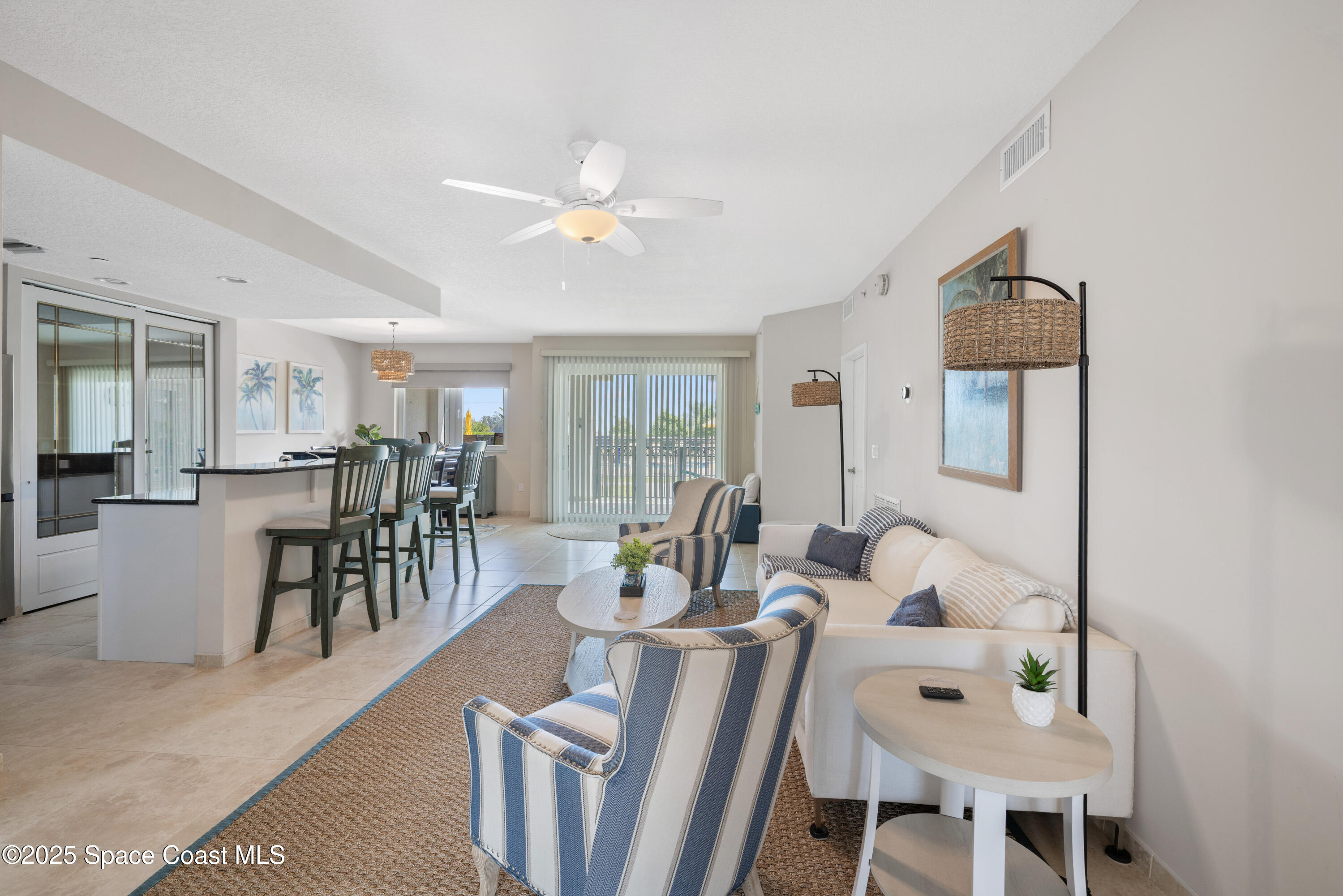 1623 Indian River Drive, Unit 103 Sebastian, FL 32958 - Photo 14 of 36 a living room with furniture and a table