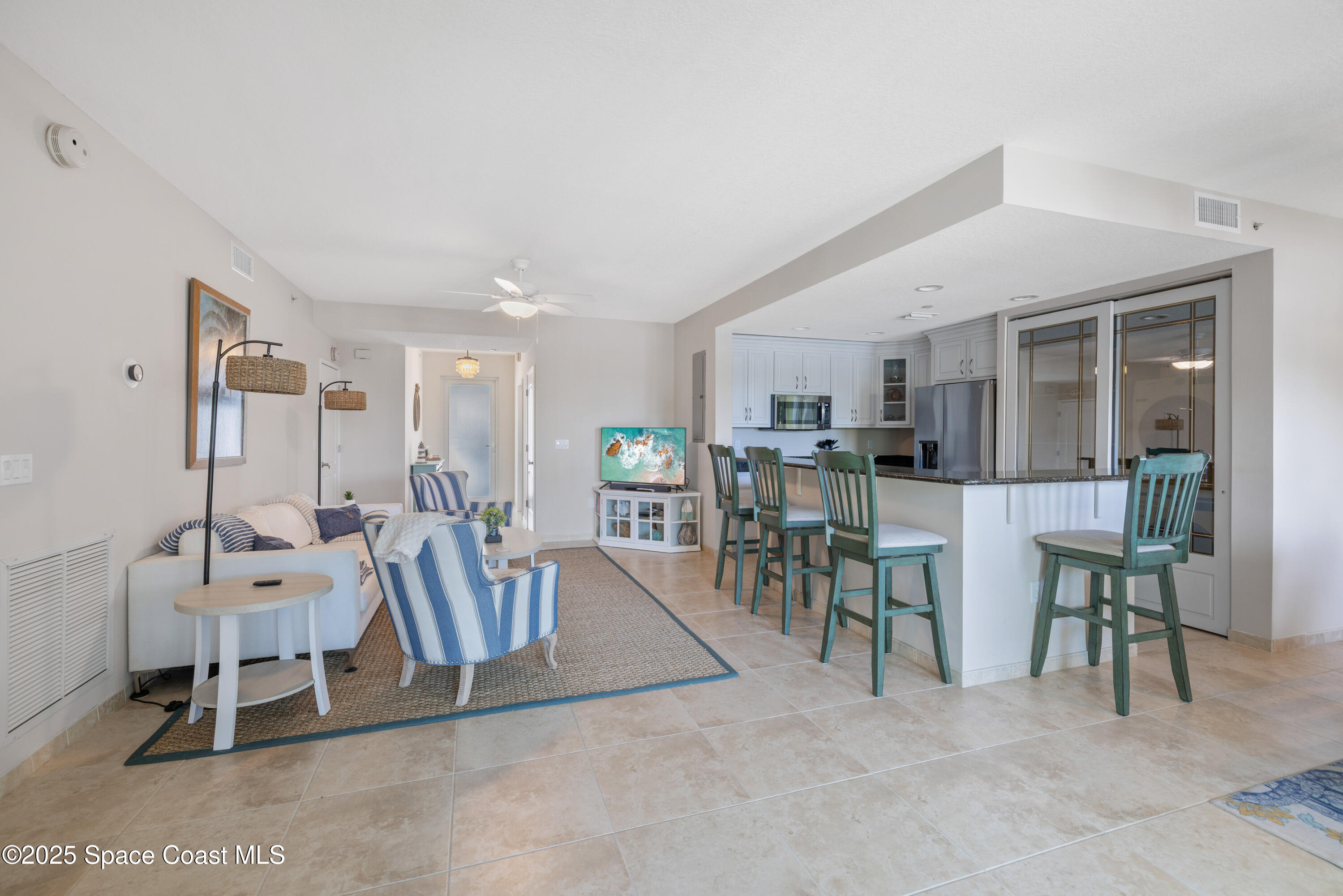1623 Indian River Drive, Unit 103 Sebastian, FL 32958 - Photo 15 of 36 a living room with furniture a table and chairs