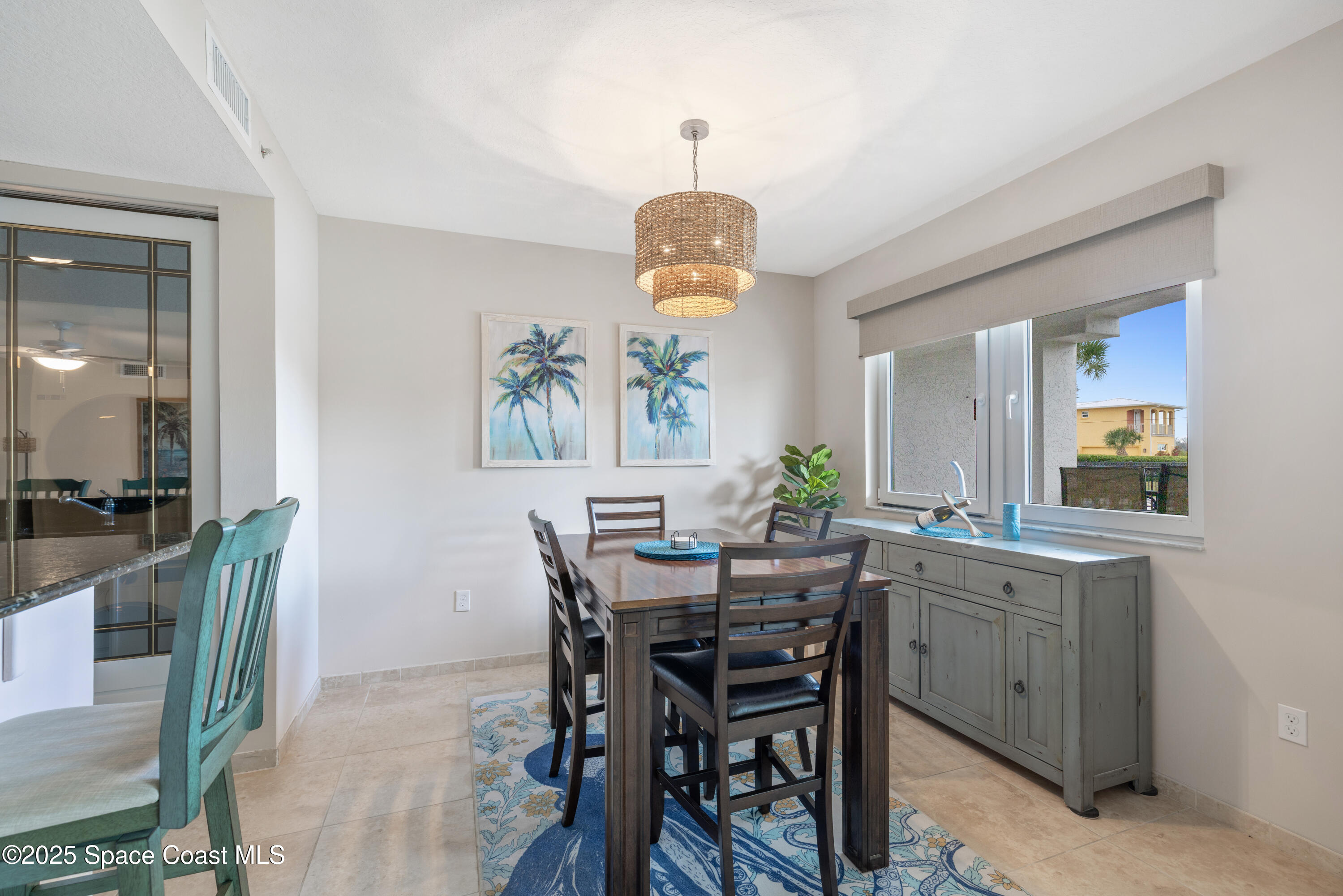 1623 Indian River Drive, Unit 103 Sebastian, FL 32958 - Photo 16 of 36 a view of a dining room with furniture and wooden floor