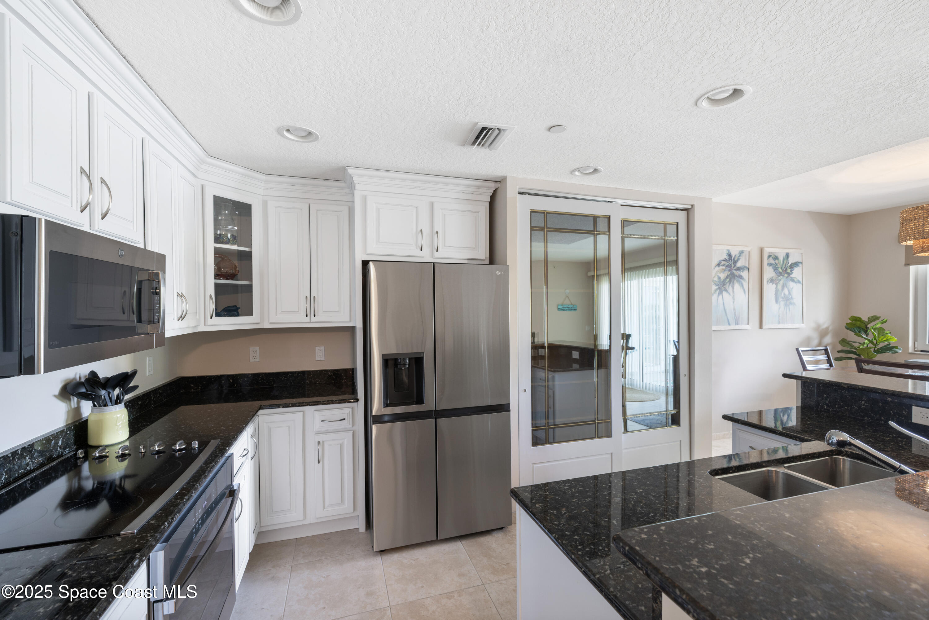 1623 Indian River Drive, Unit 103 Sebastian, FL 32958 - Photo 21 of 36 a kitchen with a refrigerator stove and sink